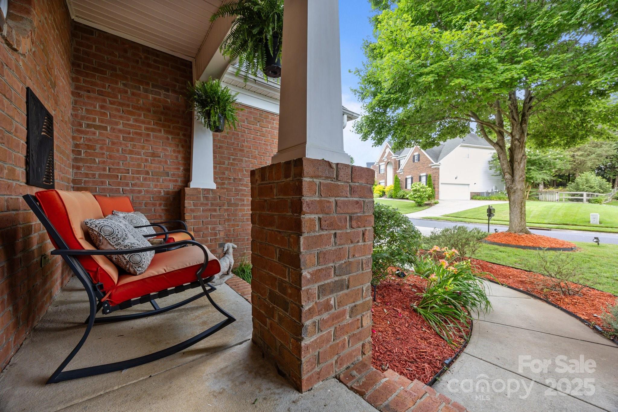 10919 Valley Spring Drive Charlotte, NC 28277 - Photo 5 of 47 a backyard of a house with outdoor seating