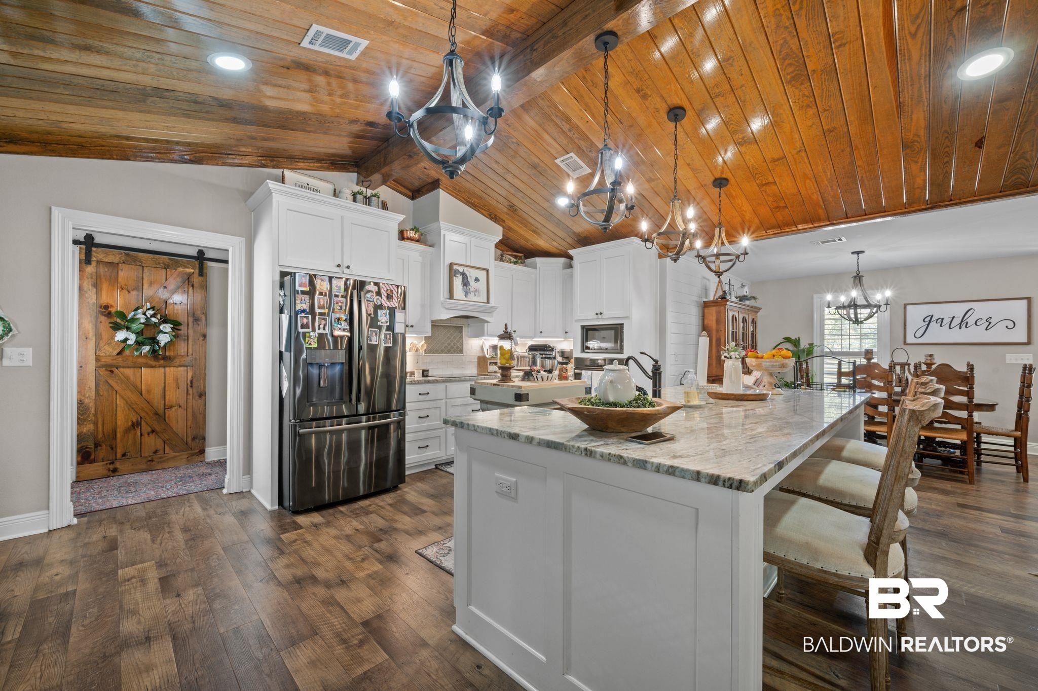 38211-d) V R Byrd Road Bay Minette, AL 36507 - Photo 9 of 58 Kitchen featuring a spacious island, stainless steel fridge, white cabinets, and hanging light fixtures