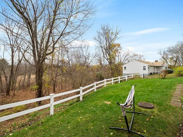 a view of backyard with trampoline