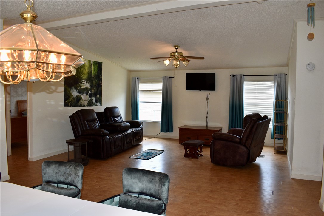 25051 Lake Shore Drive Mathis, TX 78368 - Photo 14 of 40 a living room with furniture and a flat screen tv