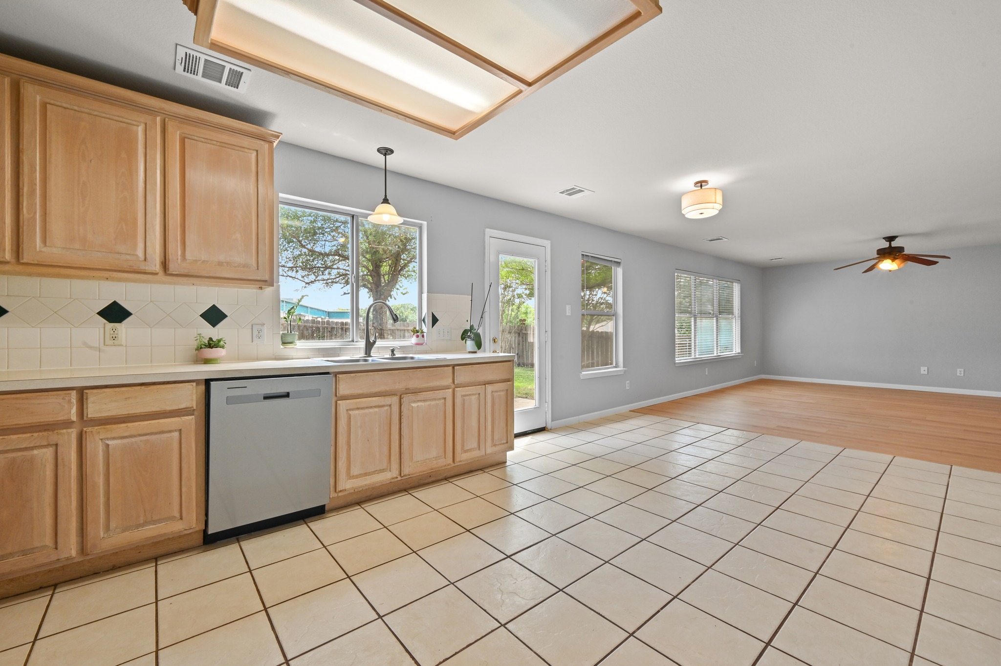 2700 Cradlerock Terrace Austin, TX 78748 - Photo 16 of 29 a kitchen with a sink cabinets and window