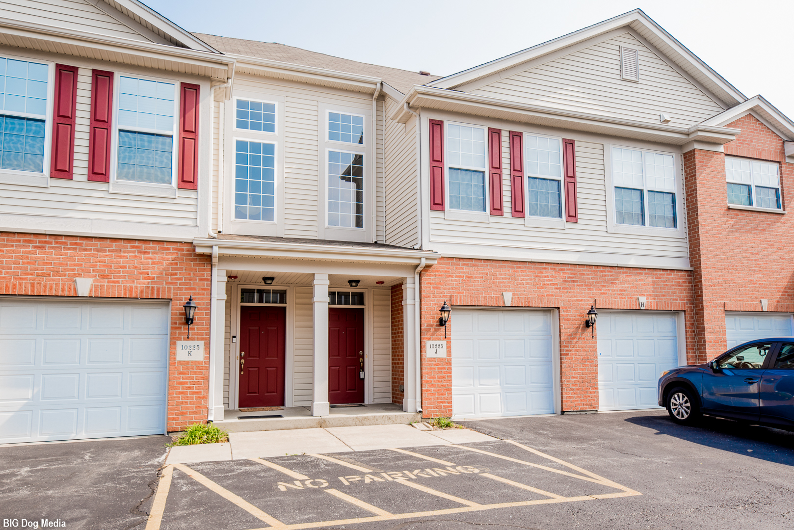 10225 Mulberry Lane, Unit J Bridgeview, IL 60455 - Photo 1 of 24 a car parked in front of a house
