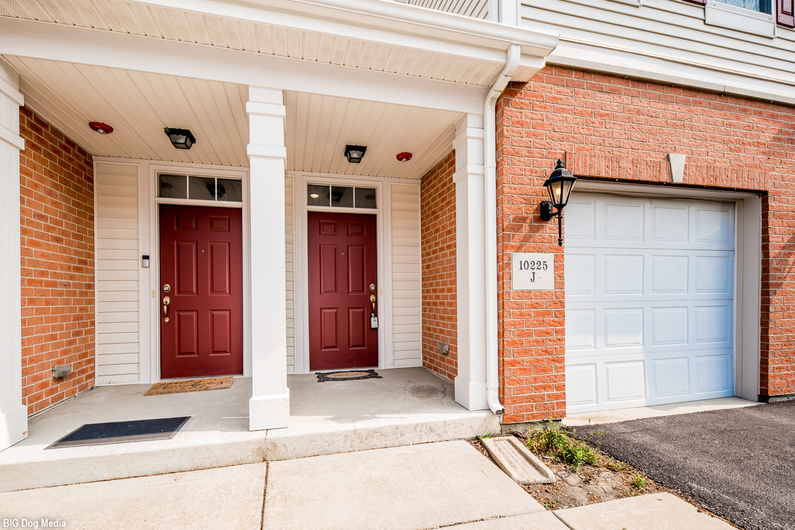 10225 Mulberry Lane, Unit J Bridgeview, IL 60455 - Photo 2 of 24 a view of a house with a door and a window