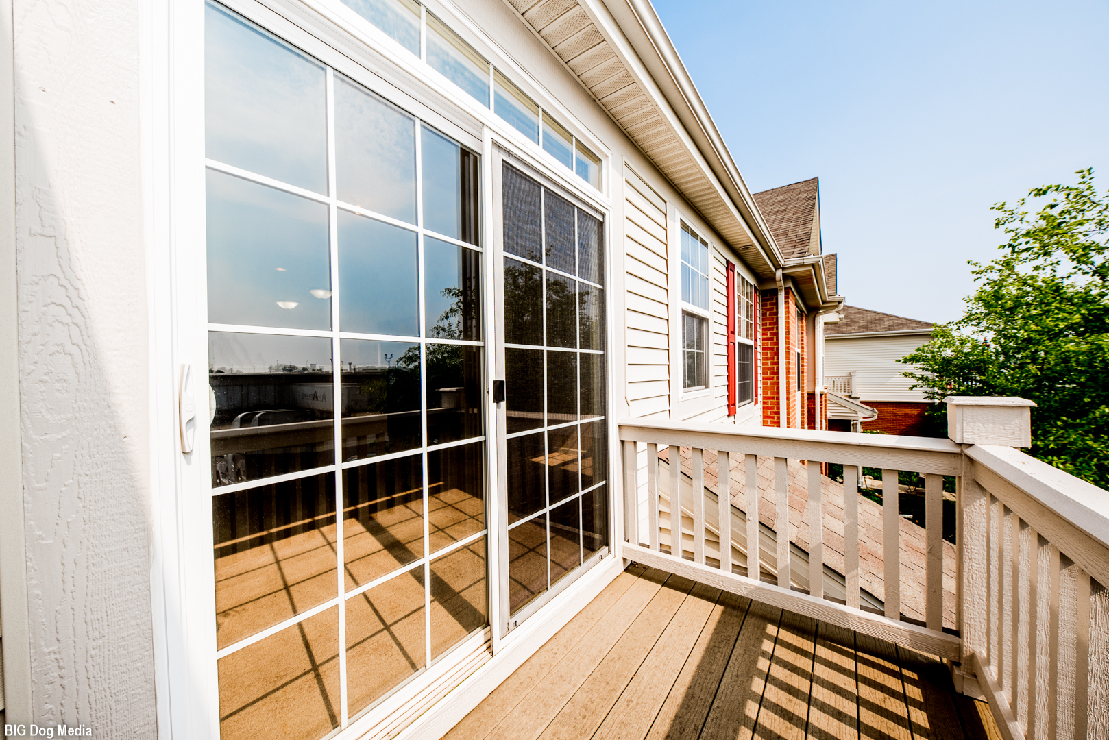10225 Mulberry Lane, Unit J Bridgeview, IL 60455 - Photo 23 of 24 a view of a balcony with wooden floor and fence