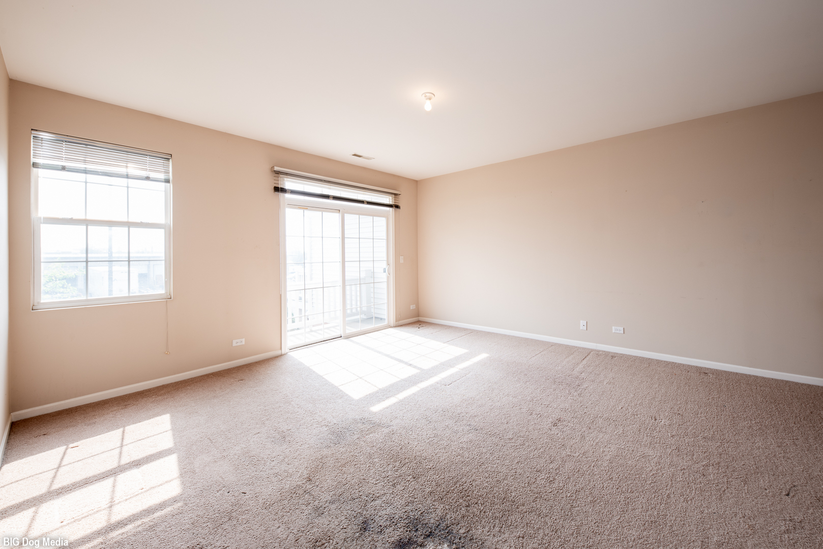 10225 Mulberry Lane, Unit J Bridgeview, IL 60455 - Photo 7 of 24 an empty room with windows
