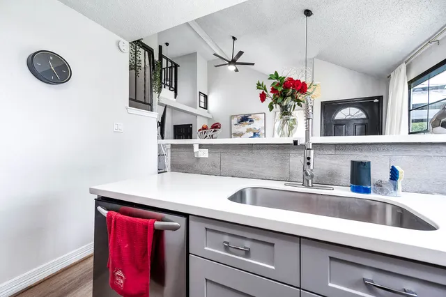 a kitchen with sink cabinets and window