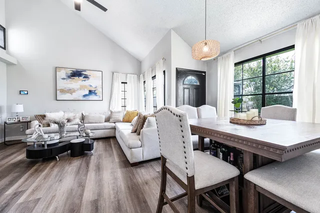 a view of a dining room with furniture window and outside view