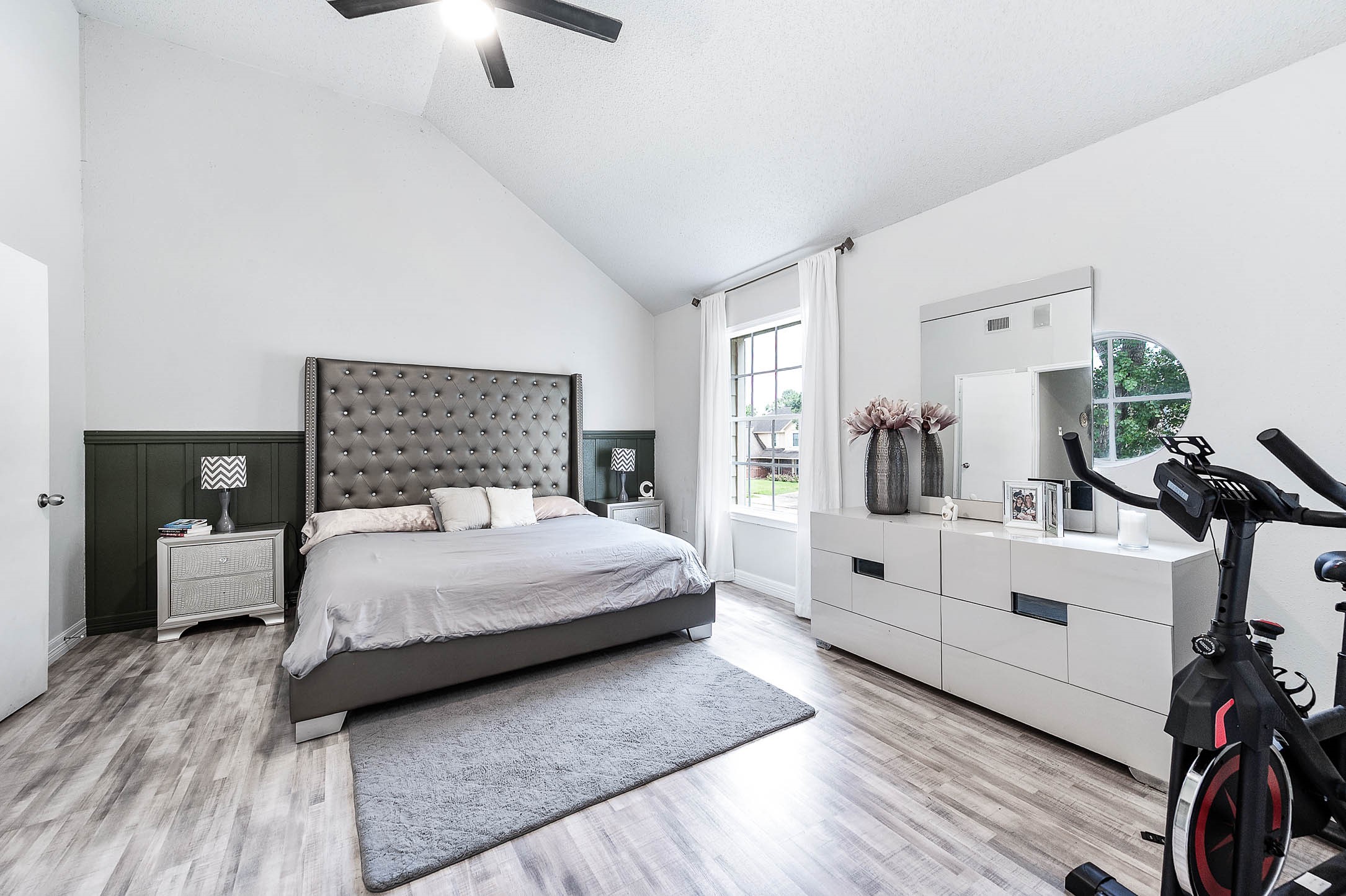 18446 North Willow Bluff Road Katy, TX 77449 - Photo 25 of 31 a bedroom with a large white bed and white walls