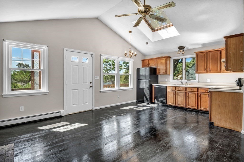 26 Indian Road Waltham, MA 02451 - Photo 10 of 32 a view of a kitchen with wooden floor and a window