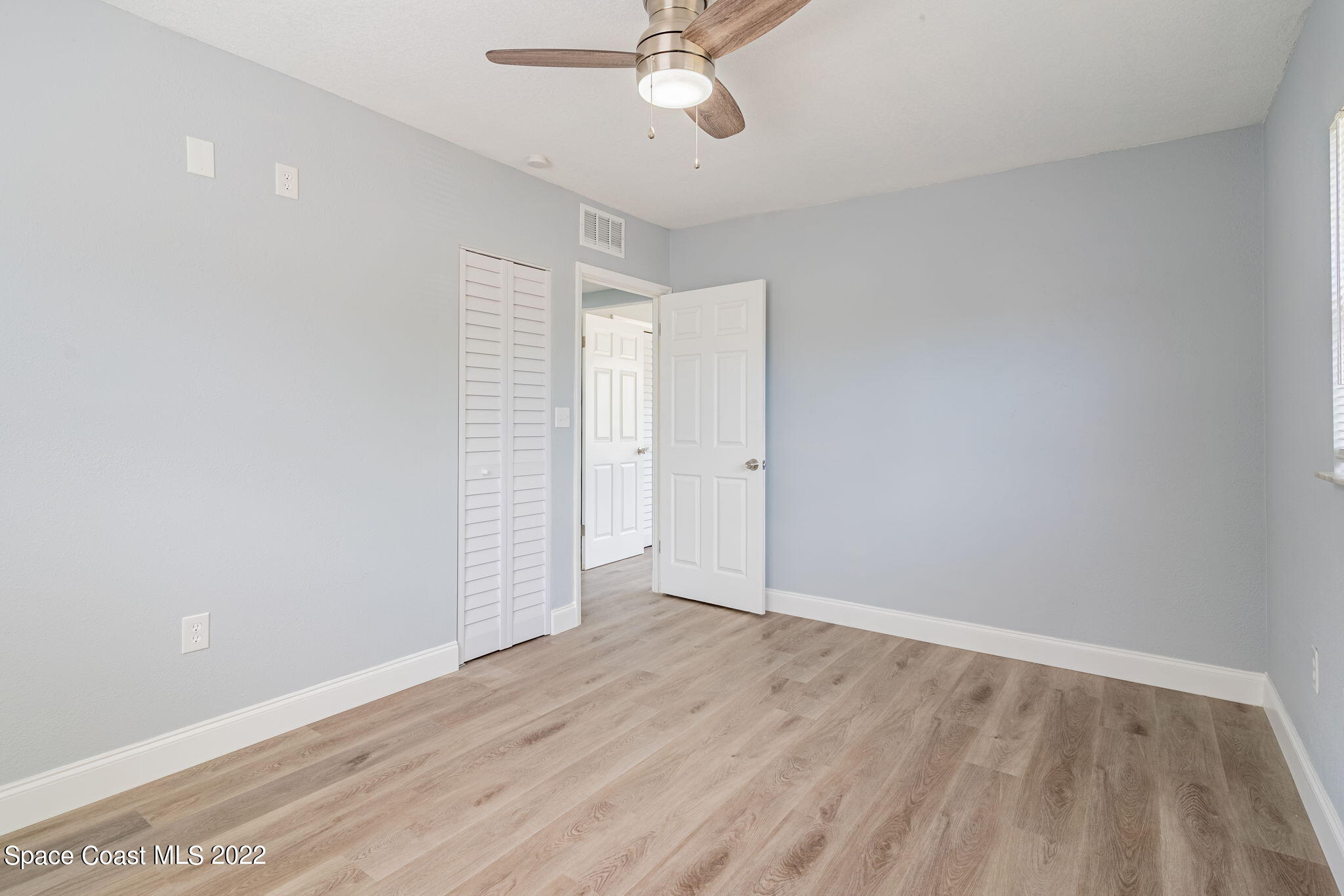302 Prospect Avenue Cocoa, FL 32922 - Photo 13 of 28 a view of an empty room with a window