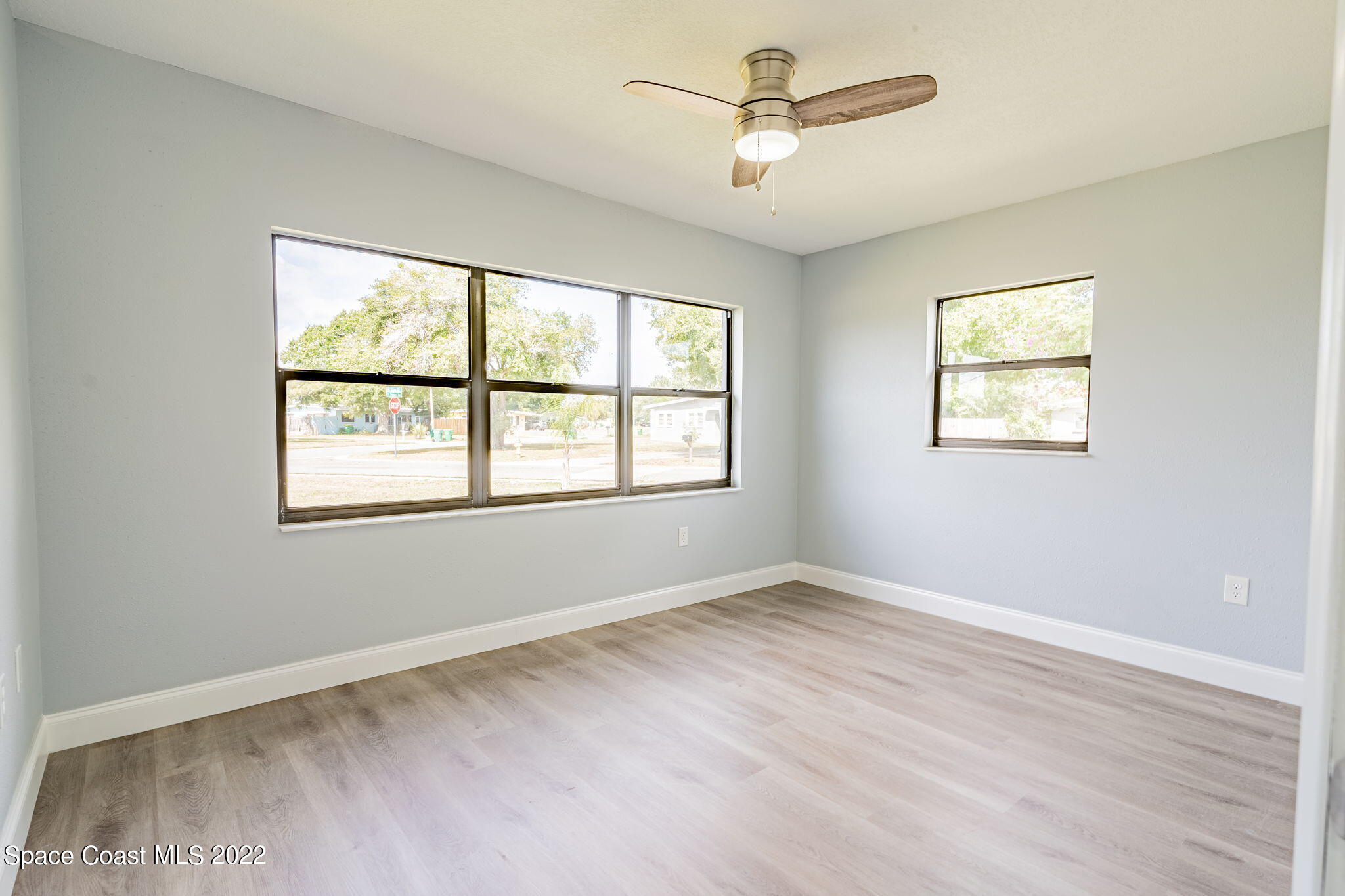 302 Prospect Avenue Cocoa, FL 32922 - Photo 18 of 28 a view of room with window and ceiling fan