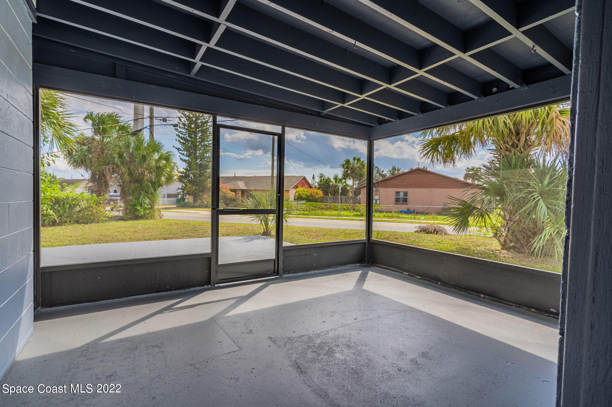 302 Prospect Avenue Cocoa, FL 32922 - Photo 22 of 28 a view of an empty room with a large window