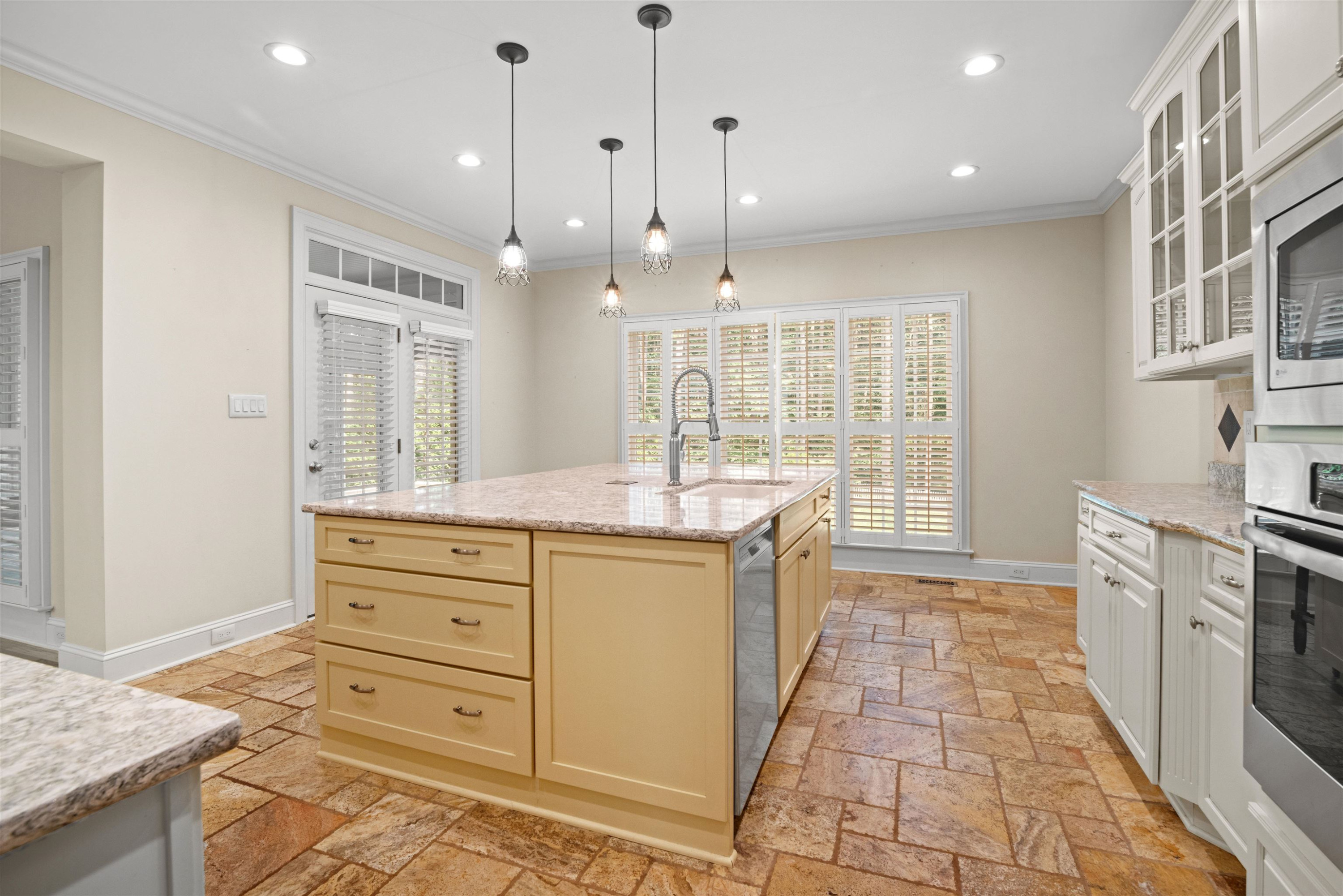 20 Jackson Road Youngsville, NC 27596 - Photo 12 of 41 a large kitchen with granite countertop a stove a sink and a refrigerator