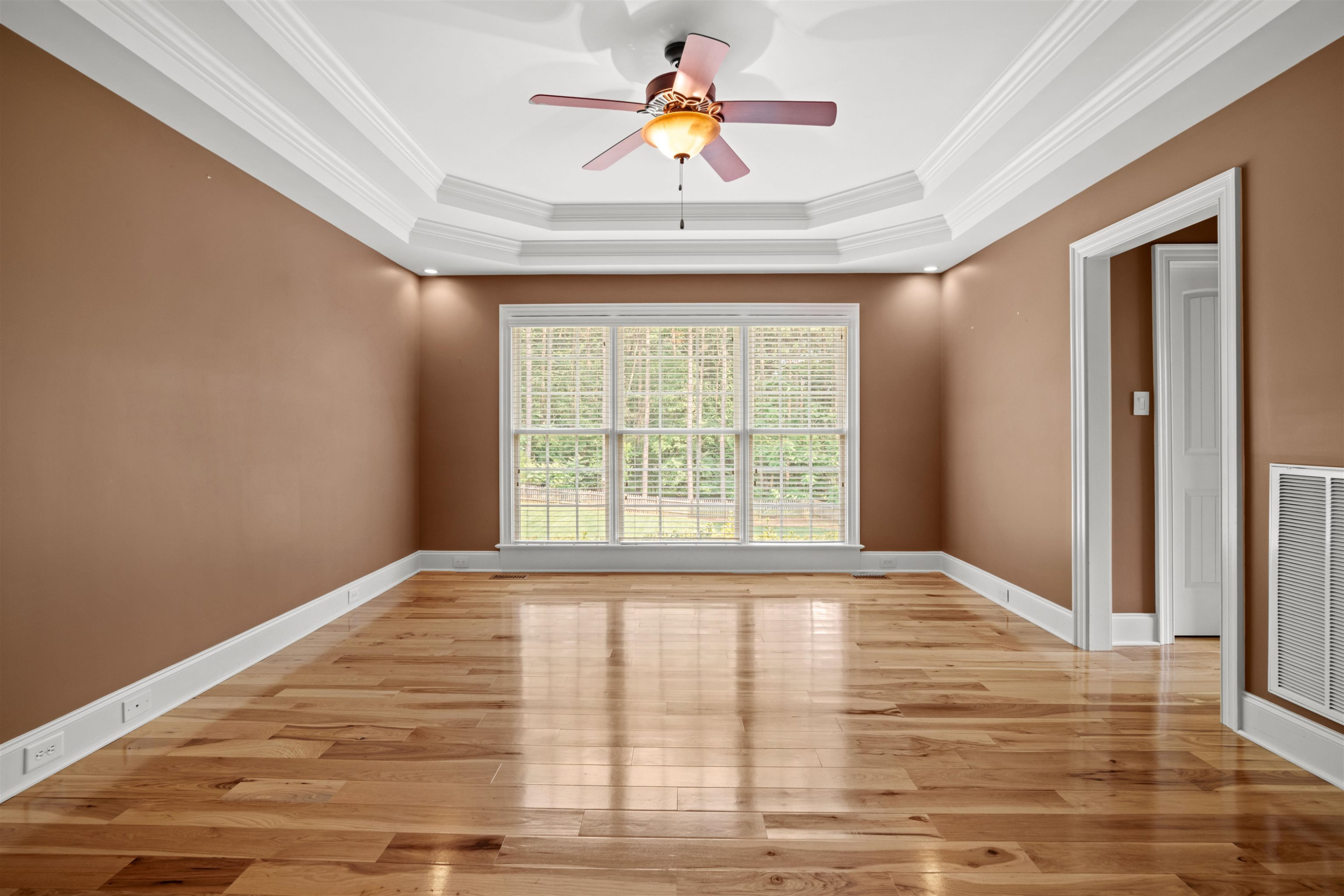 20 Jackson Road Youngsville, NC 27596 - Photo 20 of 41 a bedroom with a bed and a chandelier