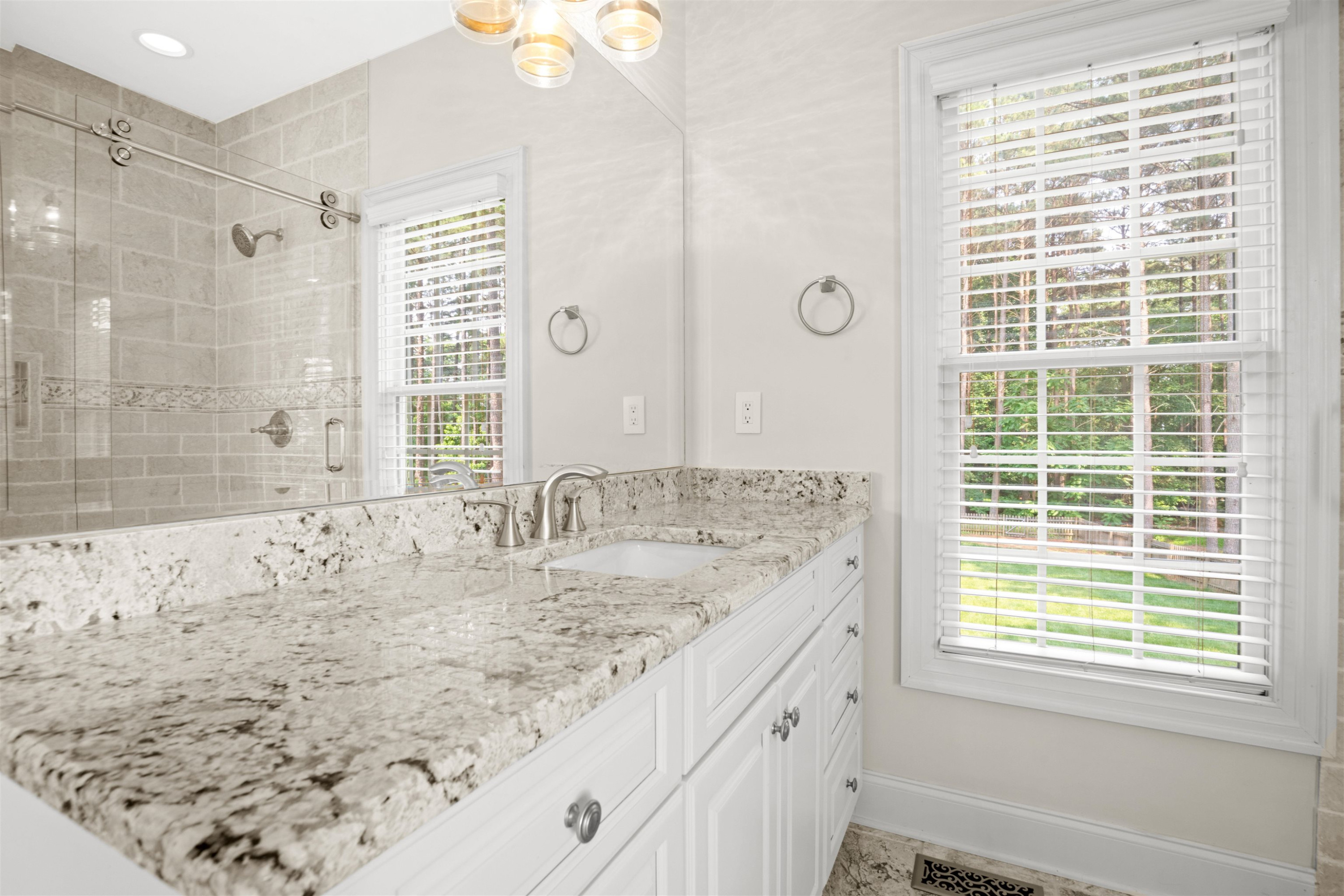 20 Jackson Road Youngsville, NC 27596 - Photo 22 of 41 a bathroom with a granite countertop sink and a bathtub