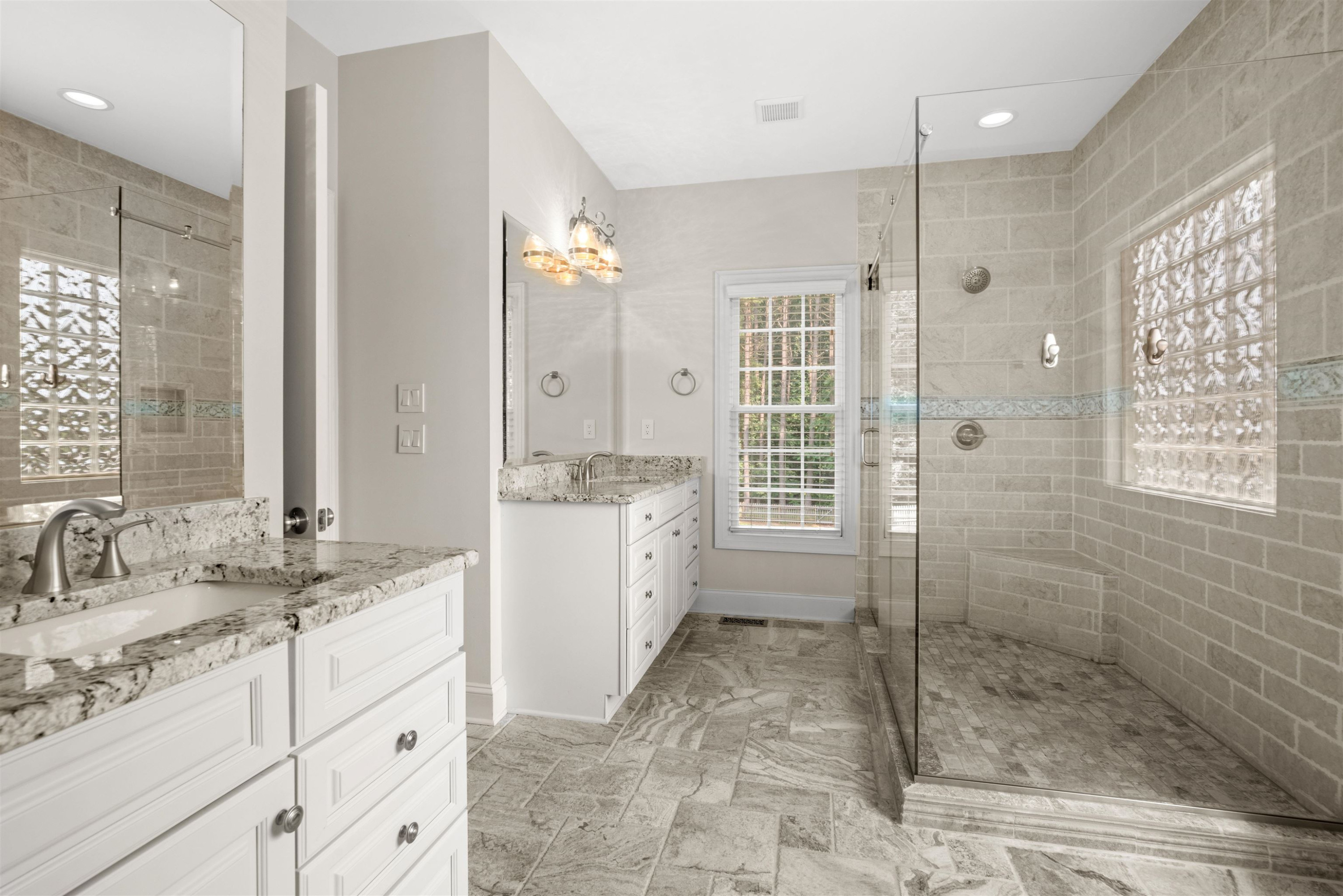 20 Jackson Road Youngsville, NC 27596 - Photo 24 of 41 a spacious bathroom with a shower sink and mirror