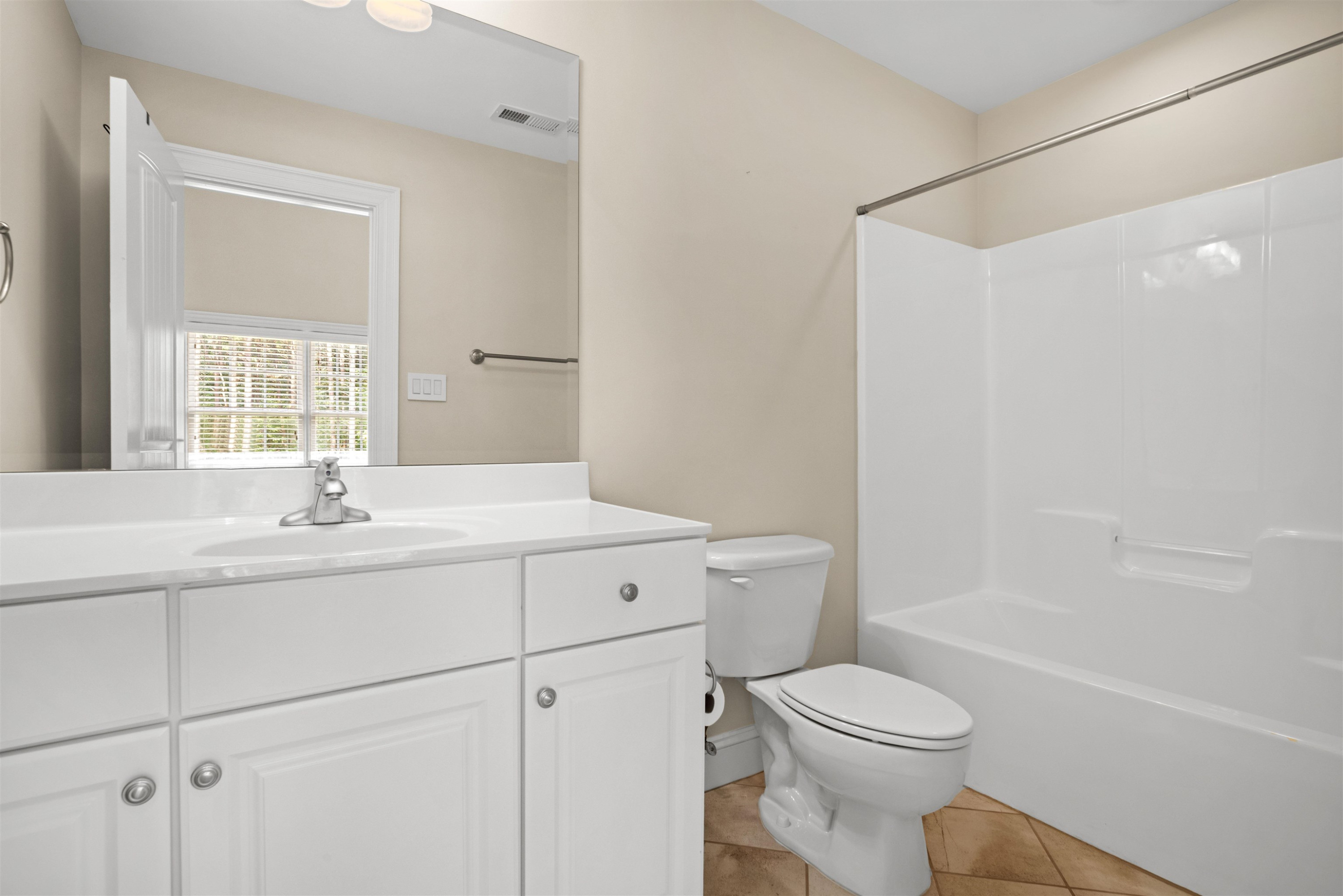 20 Jackson Road Youngsville, NC 27596 - Photo 33 of 41 a bathroom with a sink toilet vanity and tub