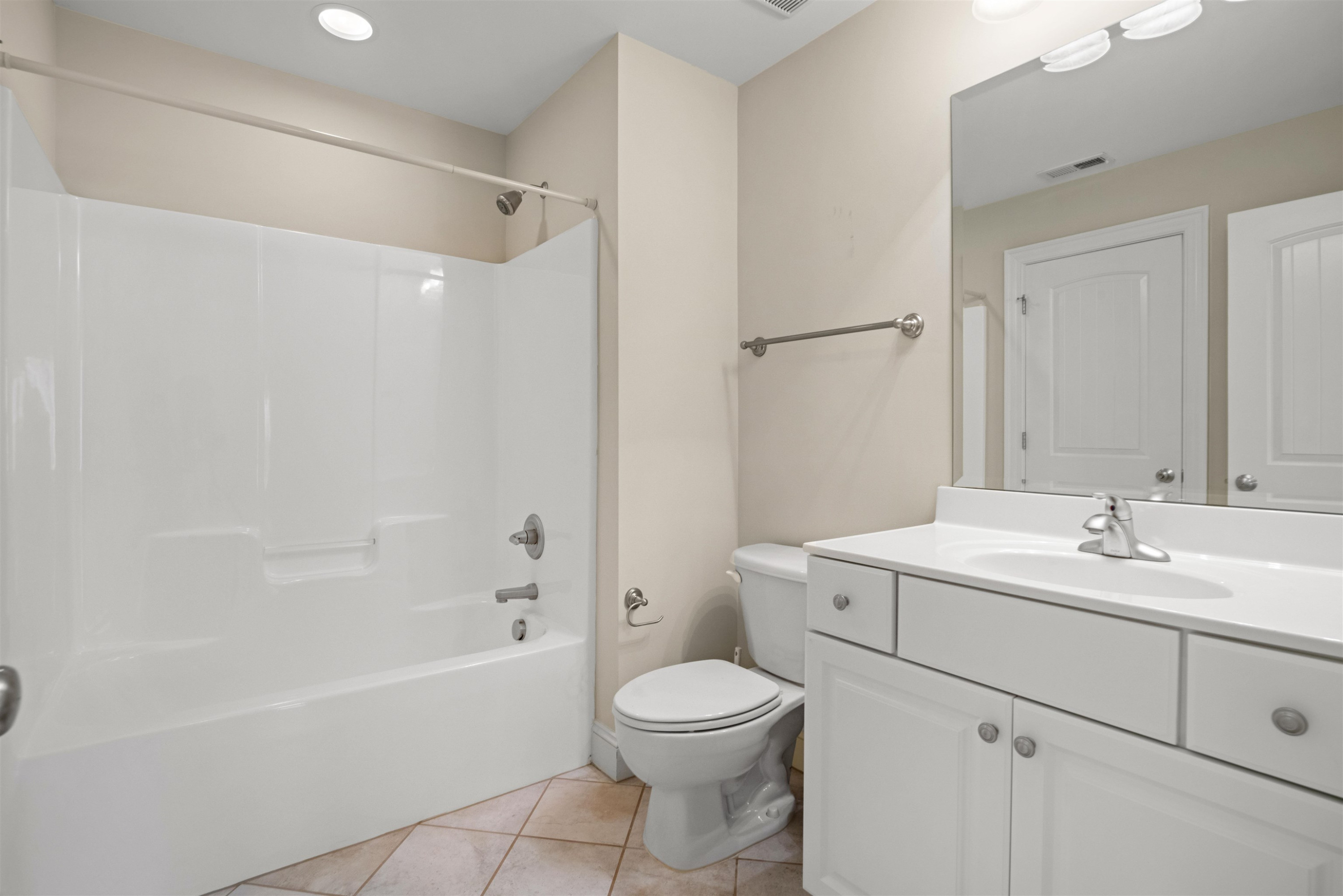 20 Jackson Road Youngsville, NC 27596 - Photo 34 of 41 a bathroom with a toilet sink vanity tub and shower