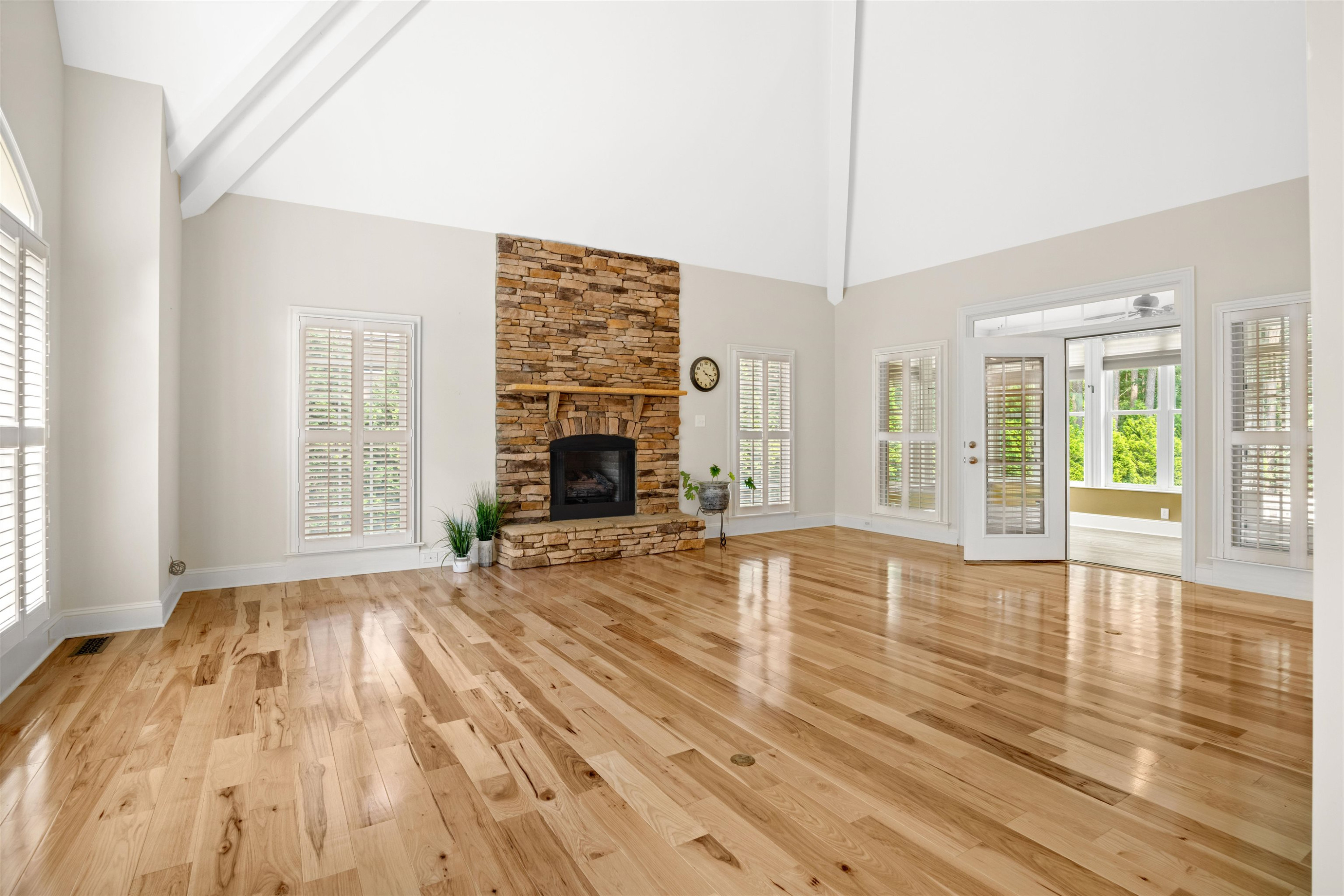 20 Jackson Road Youngsville, NC 27596 - Photo 5 of 41 a view of empty room with wooden floor and fireplace