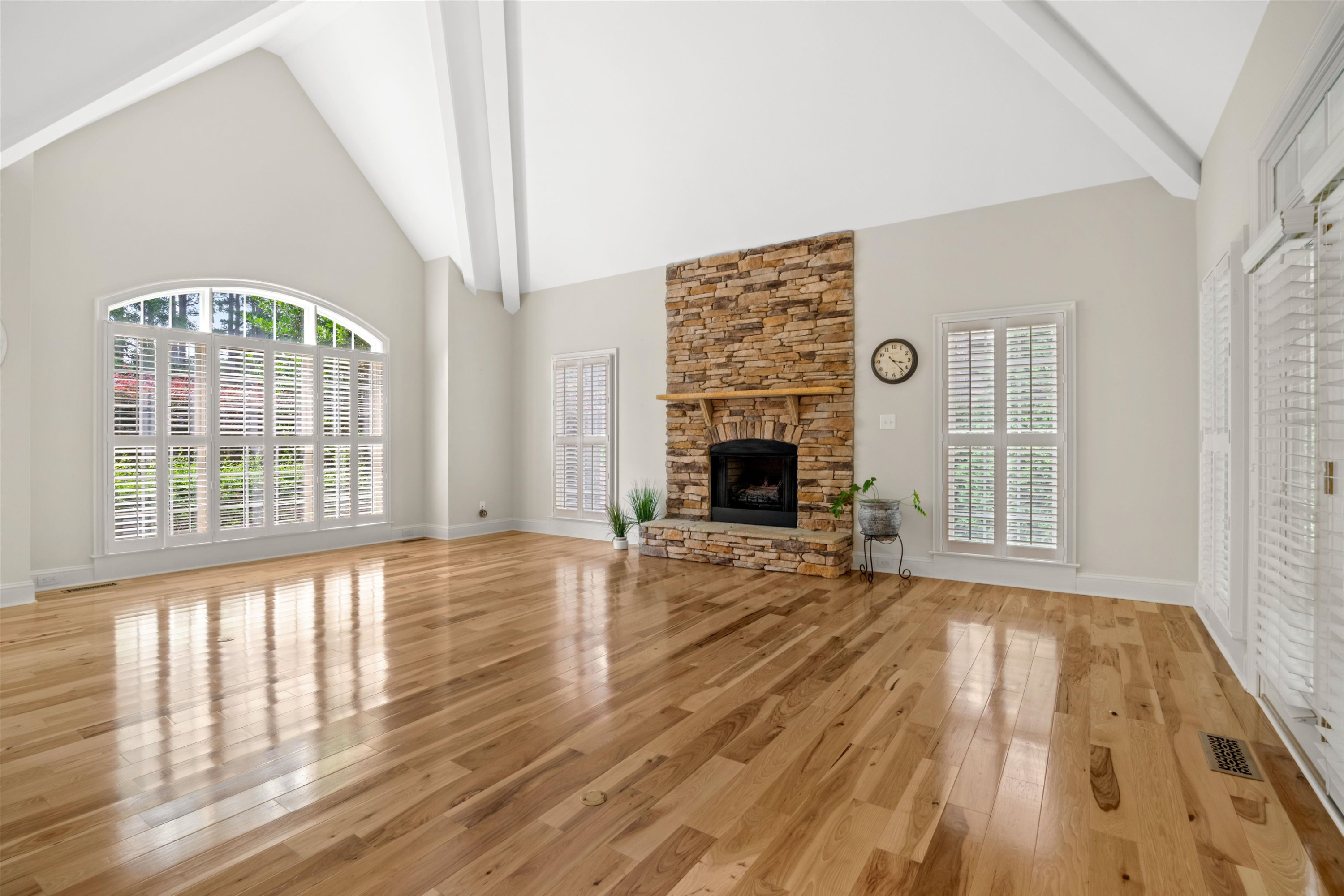20 Jackson Road Youngsville, NC 27596 - Photo 6 of 41 wooden floor fireplace and windows in an empty room
