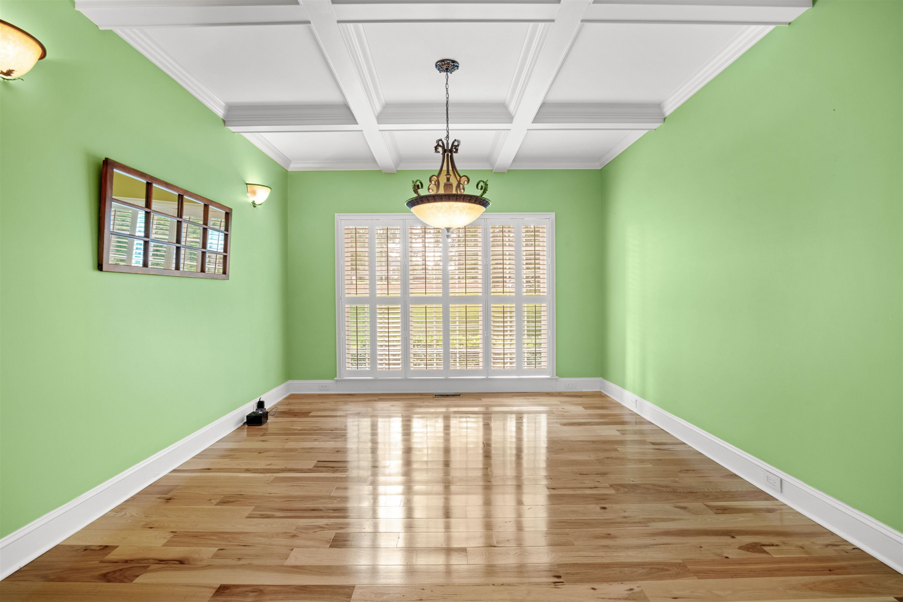 20 Jackson Road Youngsville, NC 27596 - Photo 9 of 41 a view of an empty room with window and wooden floor