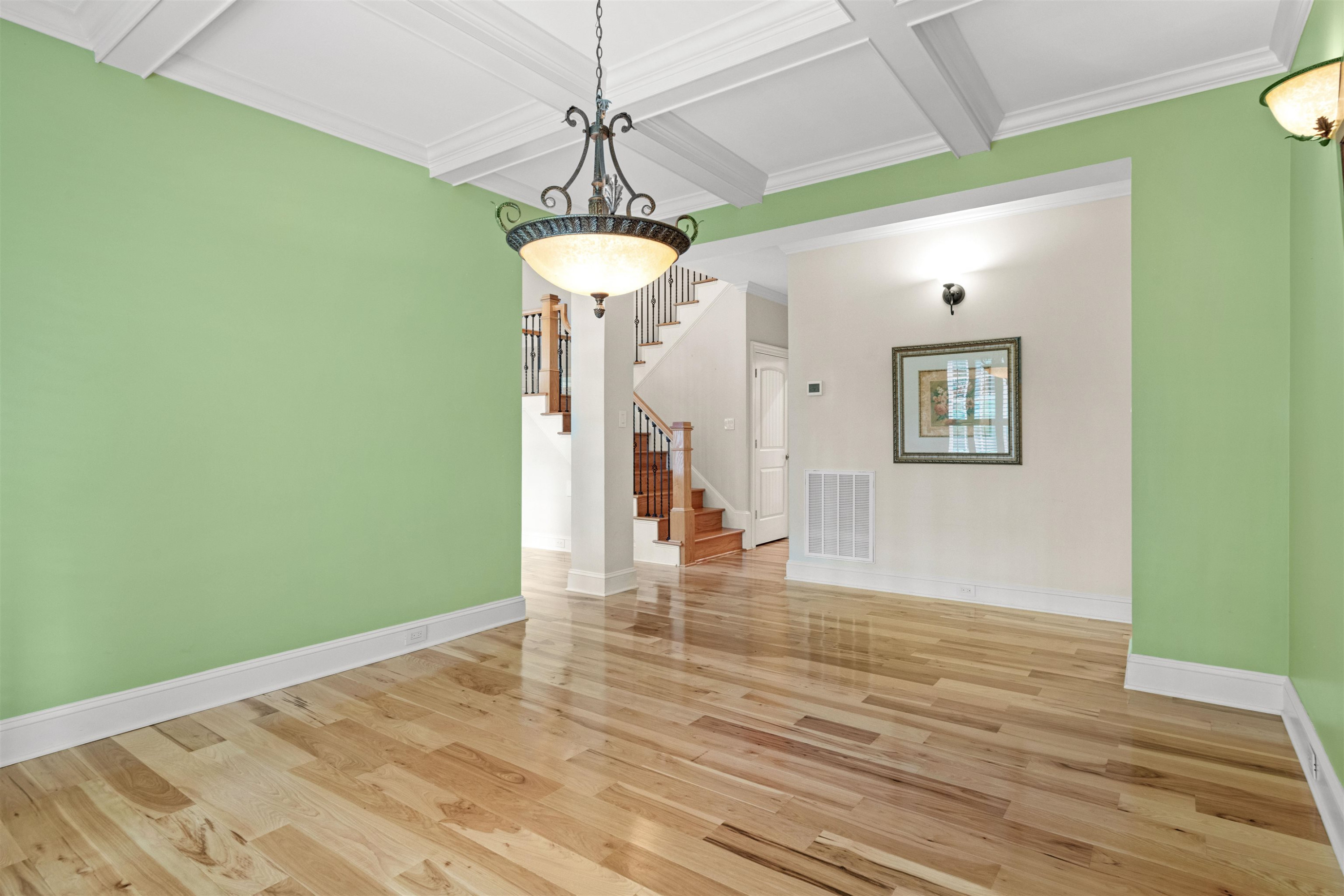 20 Jackson Road Youngsville, NC 27596 - Photo 10 of 41 a view of a livingroom with a chandelier fan and wooden floor