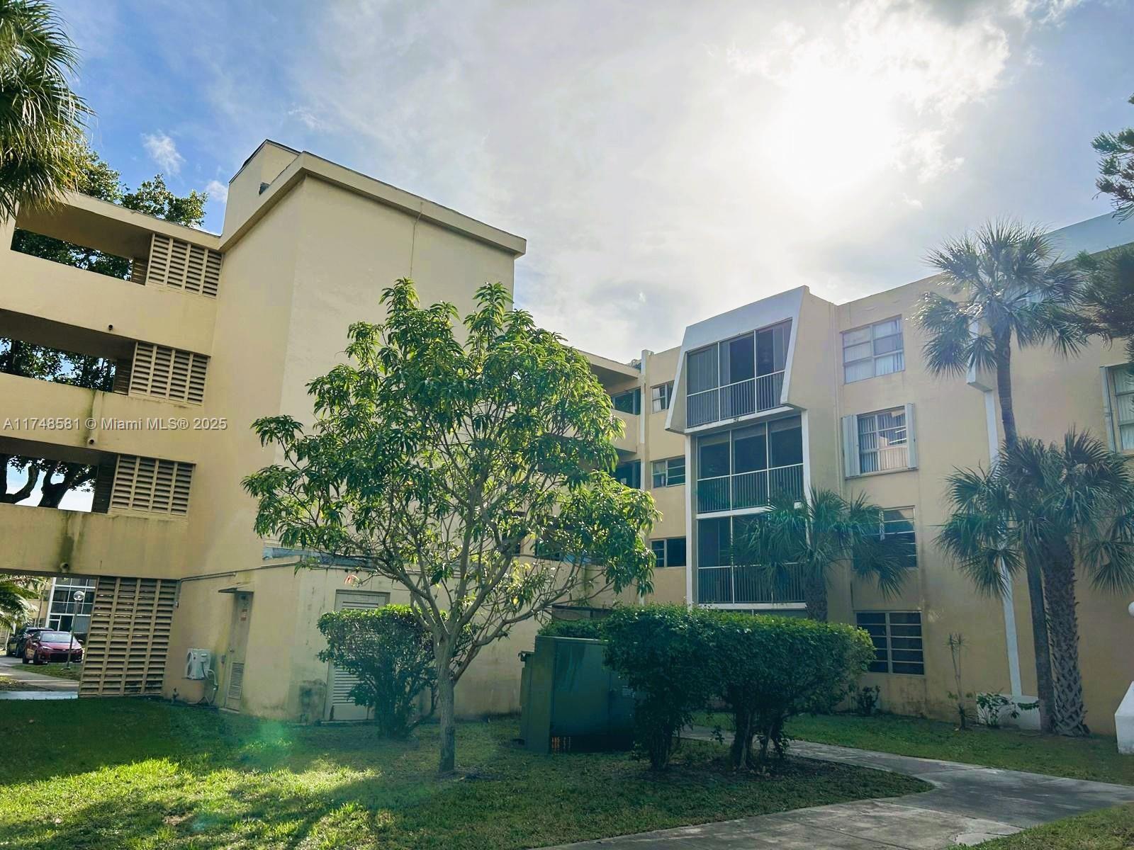 a view of a building with a yard