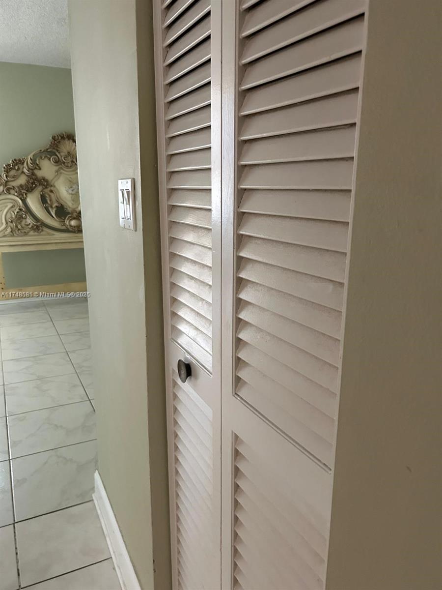 942 Northeast 199th Street, Unit 3E Miami, FL 33179 - Photo 22 of 31 a bathroom with a shower
