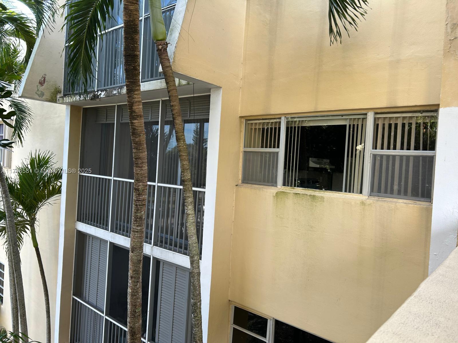 942 Northeast 199th Street, Unit 3E Miami, FL 33179 - Photo 5 of 31 a view of a house with a door