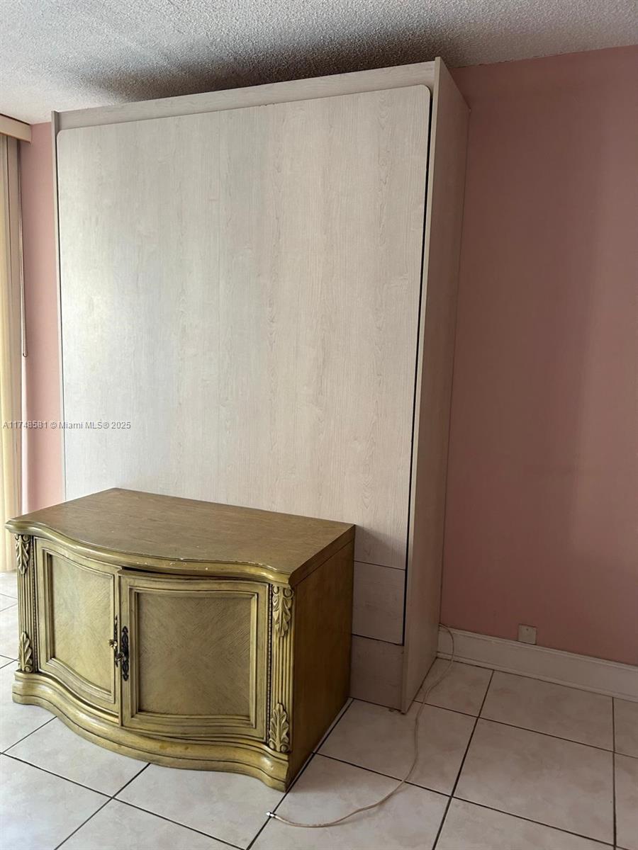 942 Northeast 199th Street, Unit 3E Miami, FL 33179 - Photo 9 of 31 a utility room with dryer and washer