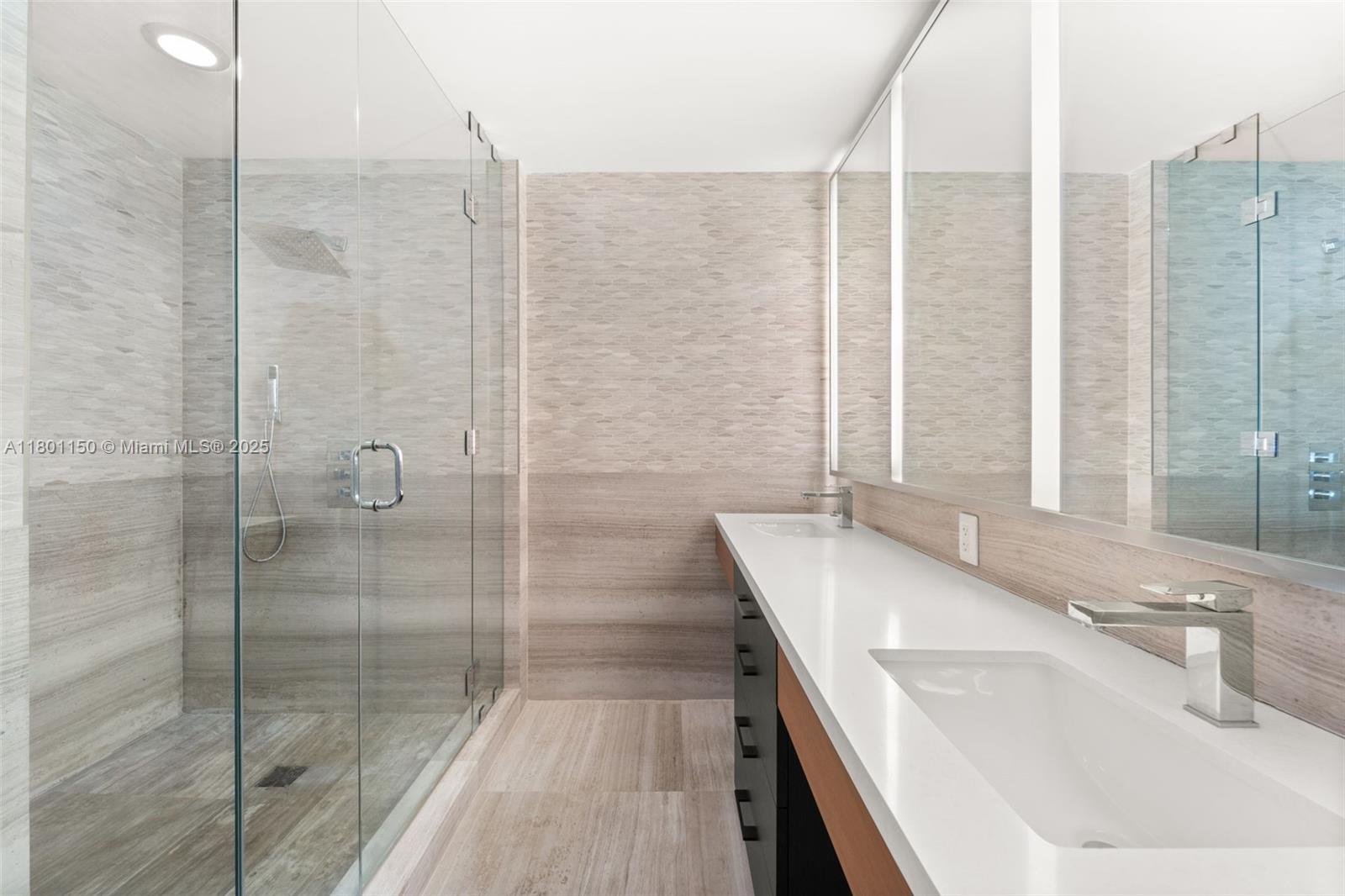 1 Collins Avenue, Unit 108 Miami Beach, FL 33139 - Photo 13 of 34 a bathroom with a tub sink and shower