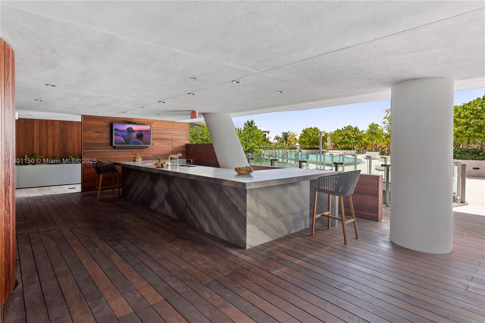 1 Collins Avenue, Unit 108 Miami Beach, FL 33139 - Photo 23 of 34 a room with wooden floors table and chairs