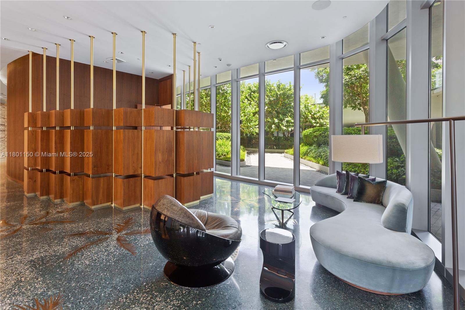 1 Collins Avenue, Unit 108 Miami Beach, FL 33139 - Photo 24 of 34 a living room with furniture and a floor to ceiling window