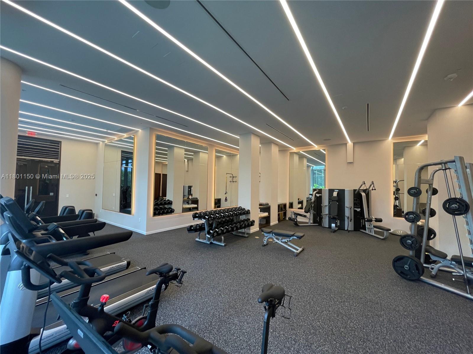 1 Collins Avenue, Unit 108 Miami Beach, FL 33139 - Photo 26 of 34 a room with gym equipment and view of gym equipment