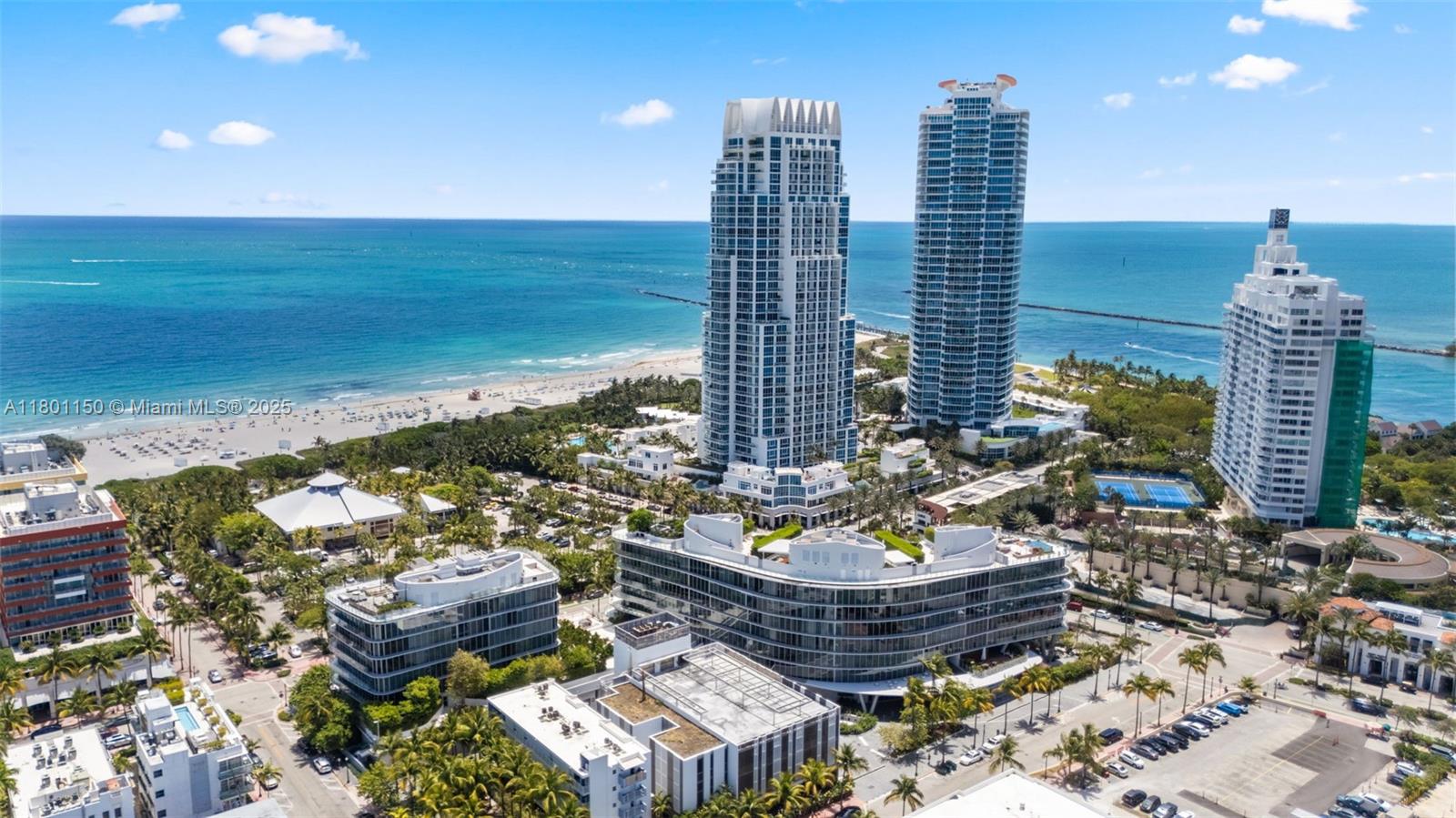 1 Collins Avenue, Unit 108 Miami Beach, FL 33139 - Photo 31 of 34 a room with water fountain and outdoor seating
