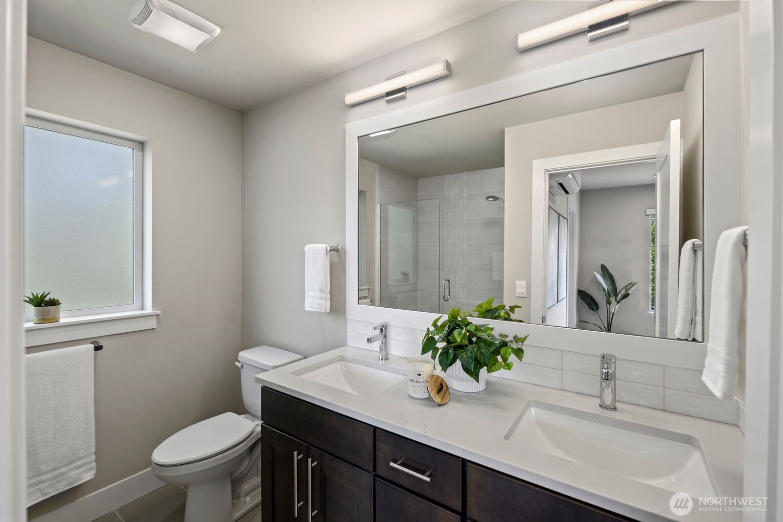 826 238th Place Southeast, Unit F Bothell, WA 98021 - Photo 15 of 39 a bathroom with a sink and a mirror