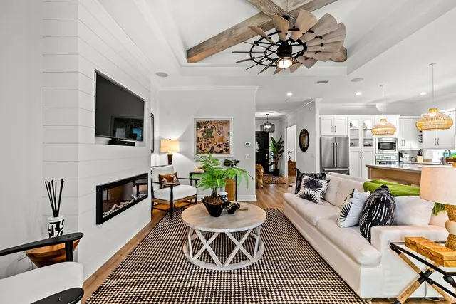 a kitchen with stainless steel appliances granite countertop a stove and a wooden floors