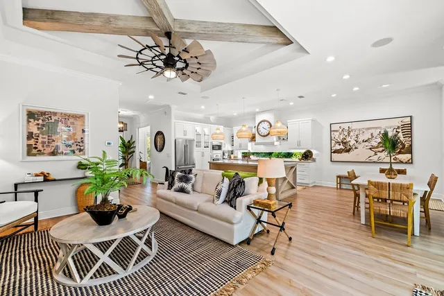 a bathroom with a granite countertop double vanity sink and a large mirror