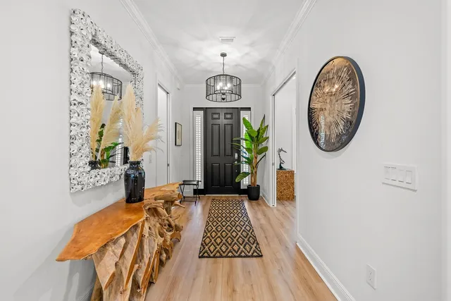 a living room with furniture or couch and a chandelier