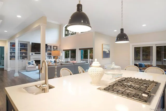 a large kitchen with a table and chairs