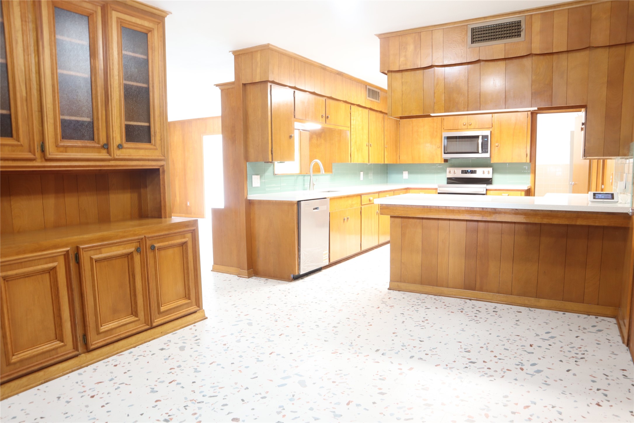 1903 Evergreen La Marque, TX 77568 - Photo 12 of 33 a kitchen with stainless steel appliances granite countertop a sink and cabinets