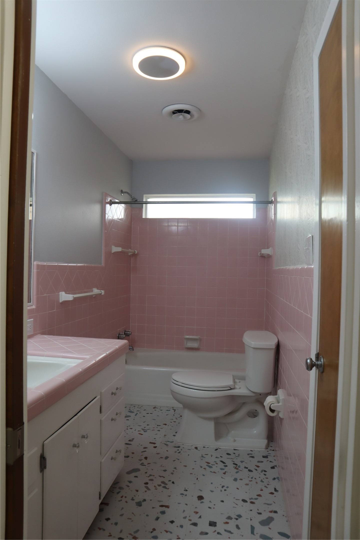 1903 Evergreen La Marque, TX 77568 - Photo 17 of 33 a bathroom with a toilet sink and mirror