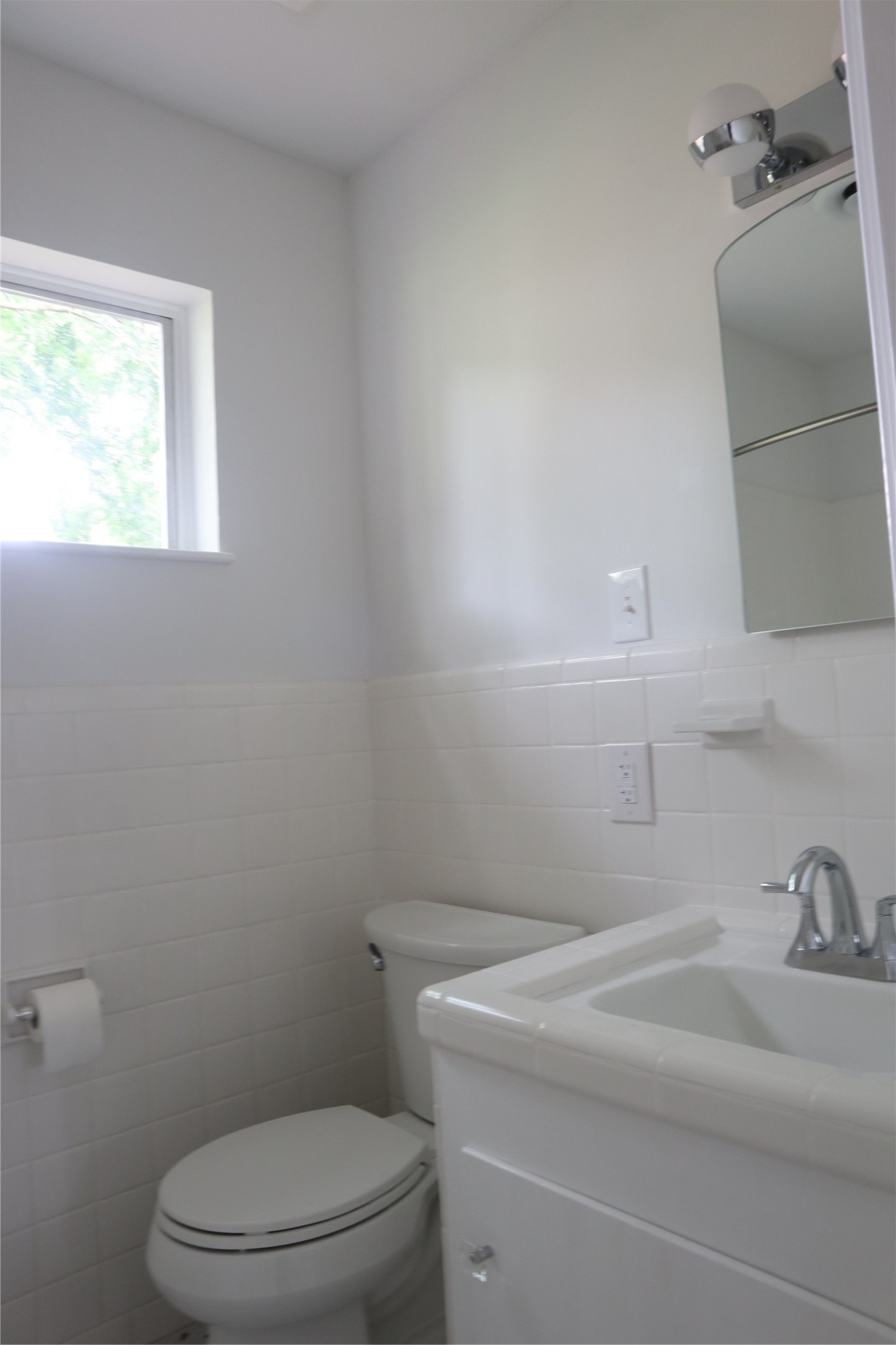 1903 Evergreen La Marque, TX 77568 - Photo 25 of 33 a bathroom with a sink a toilet and a window