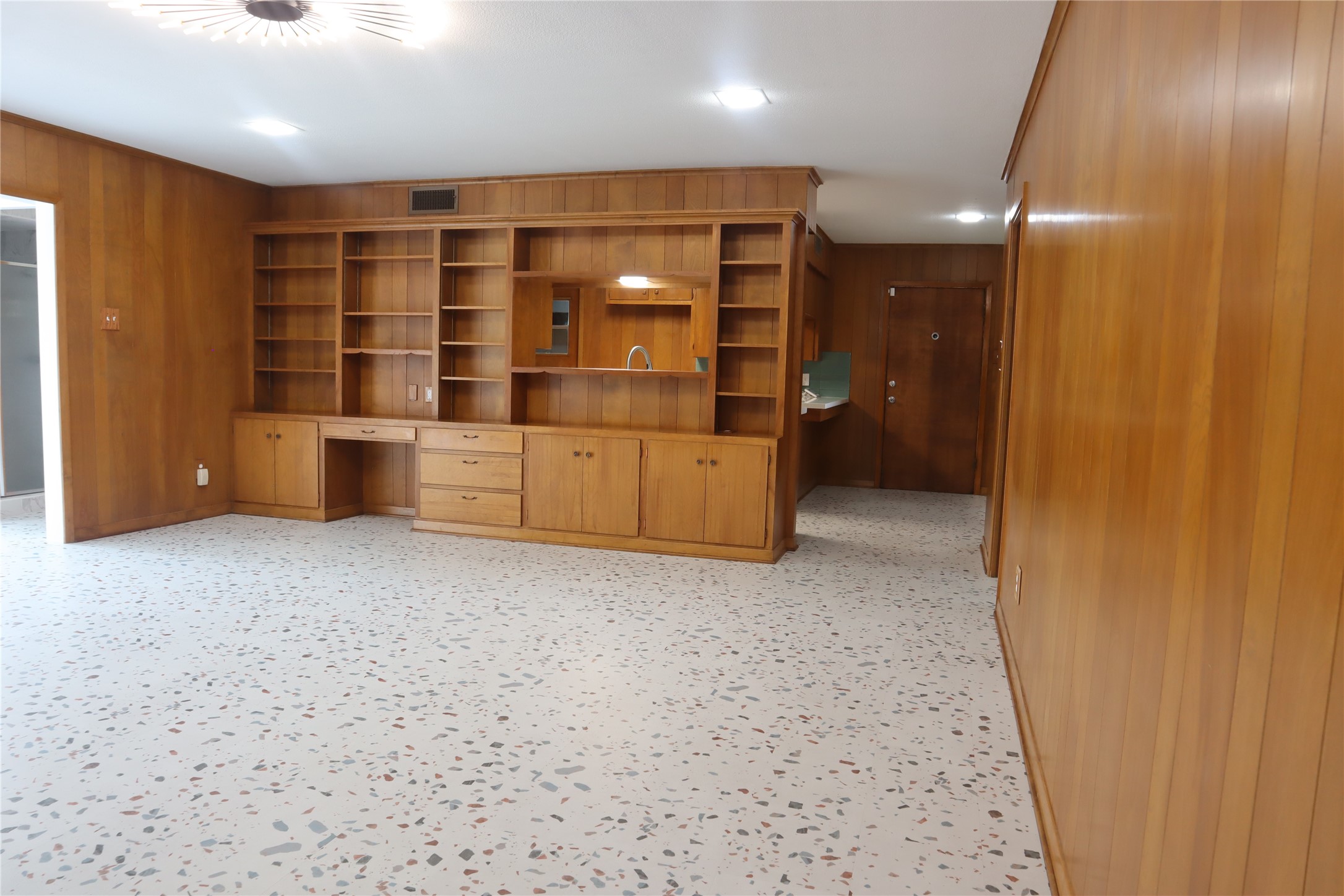 1903 Evergreen La Marque, TX 77568 - Photo 4 of 33 a view of an empty room with furniture and wooden shelves