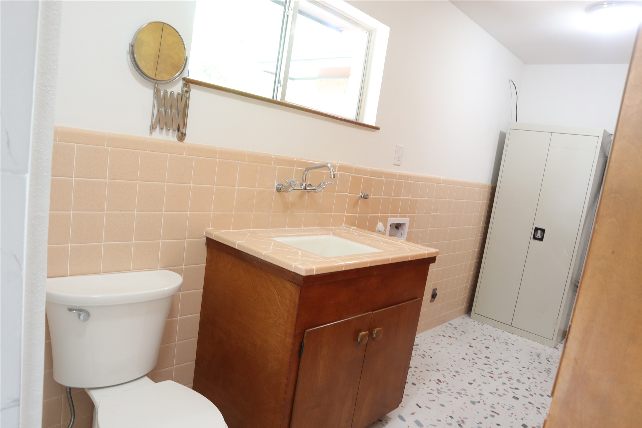 1903 Evergreen La Marque, TX 77568 - Photo 8 of 33 a bathroom with a toilet sink and mirror