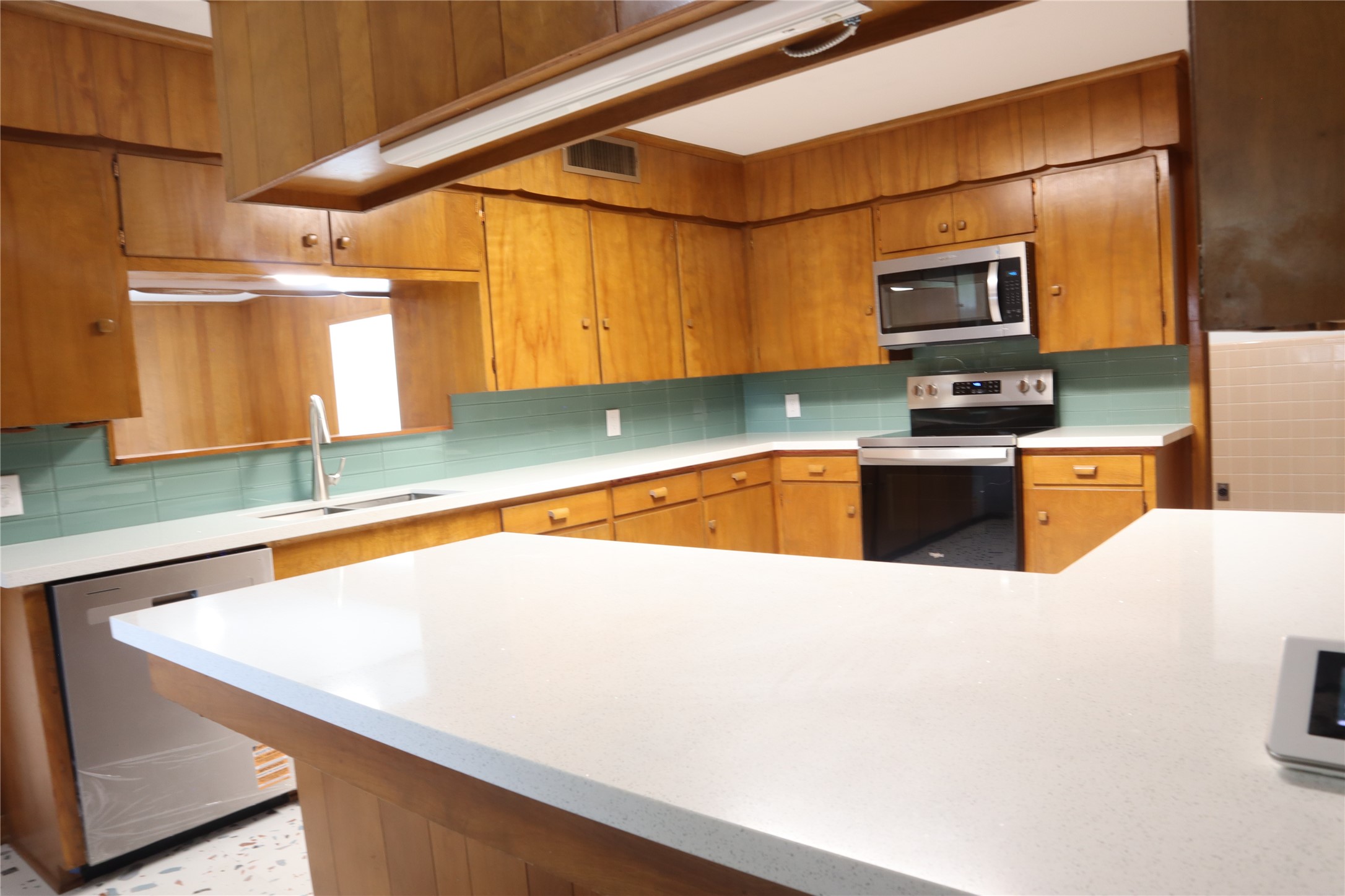 1903 Evergreen La Marque, TX 77568 - Photo 10 of 33 a kitchen with stainless steel appliances a sink and a microwave