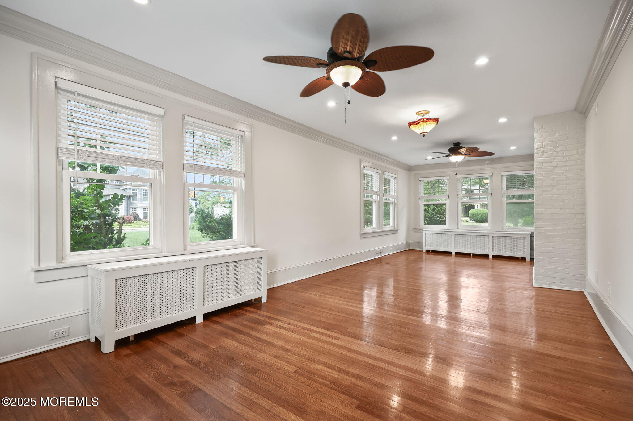 3 River Road Rumson, NJ 07760 - Photo 4 of 22 a view of an empty room with a window and wooden floor