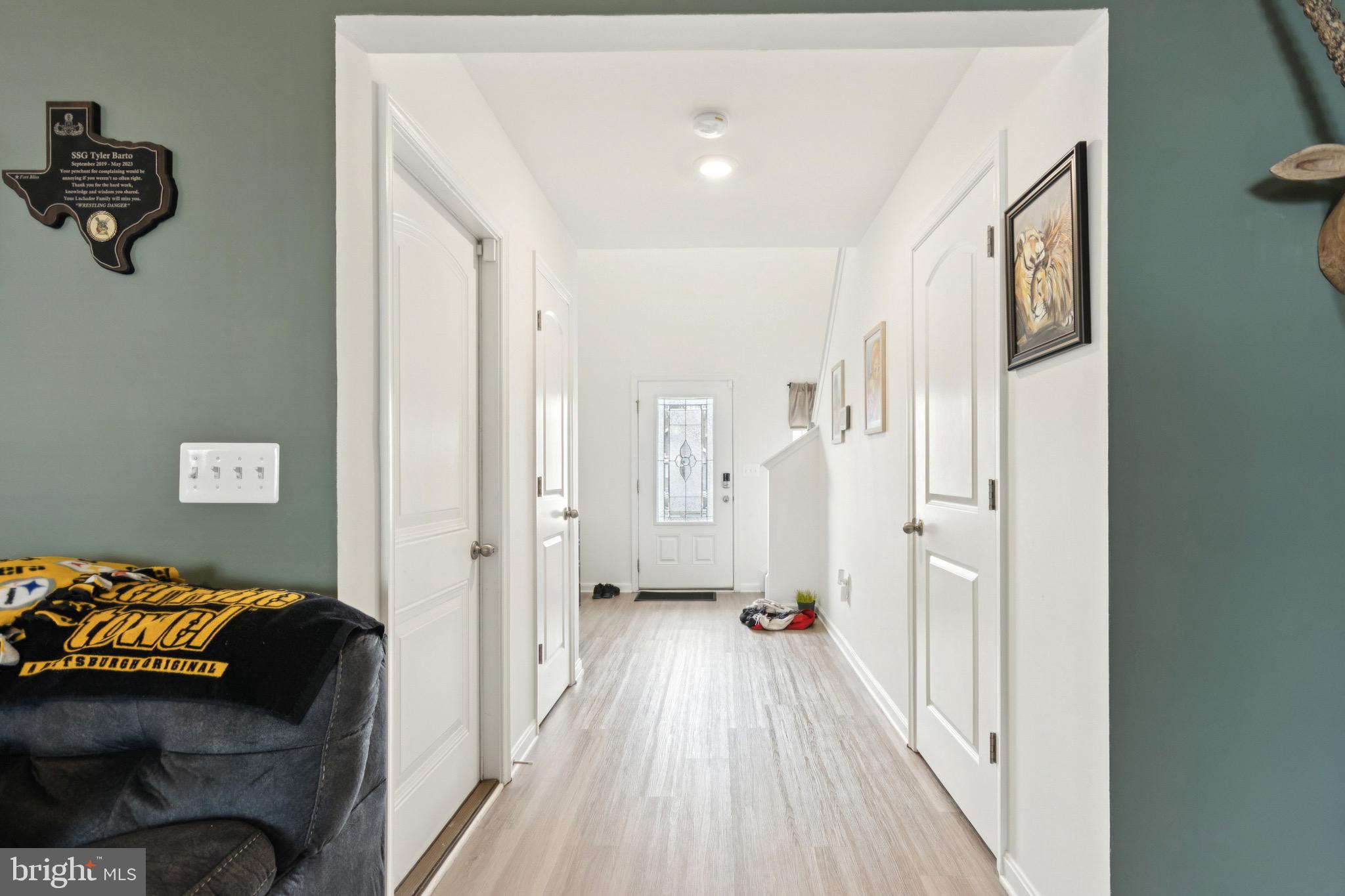 17063 Rollins Road Bowling Green, VA 22427 - Photo 11 of 40 a view of walk in closet with clothes and shoes