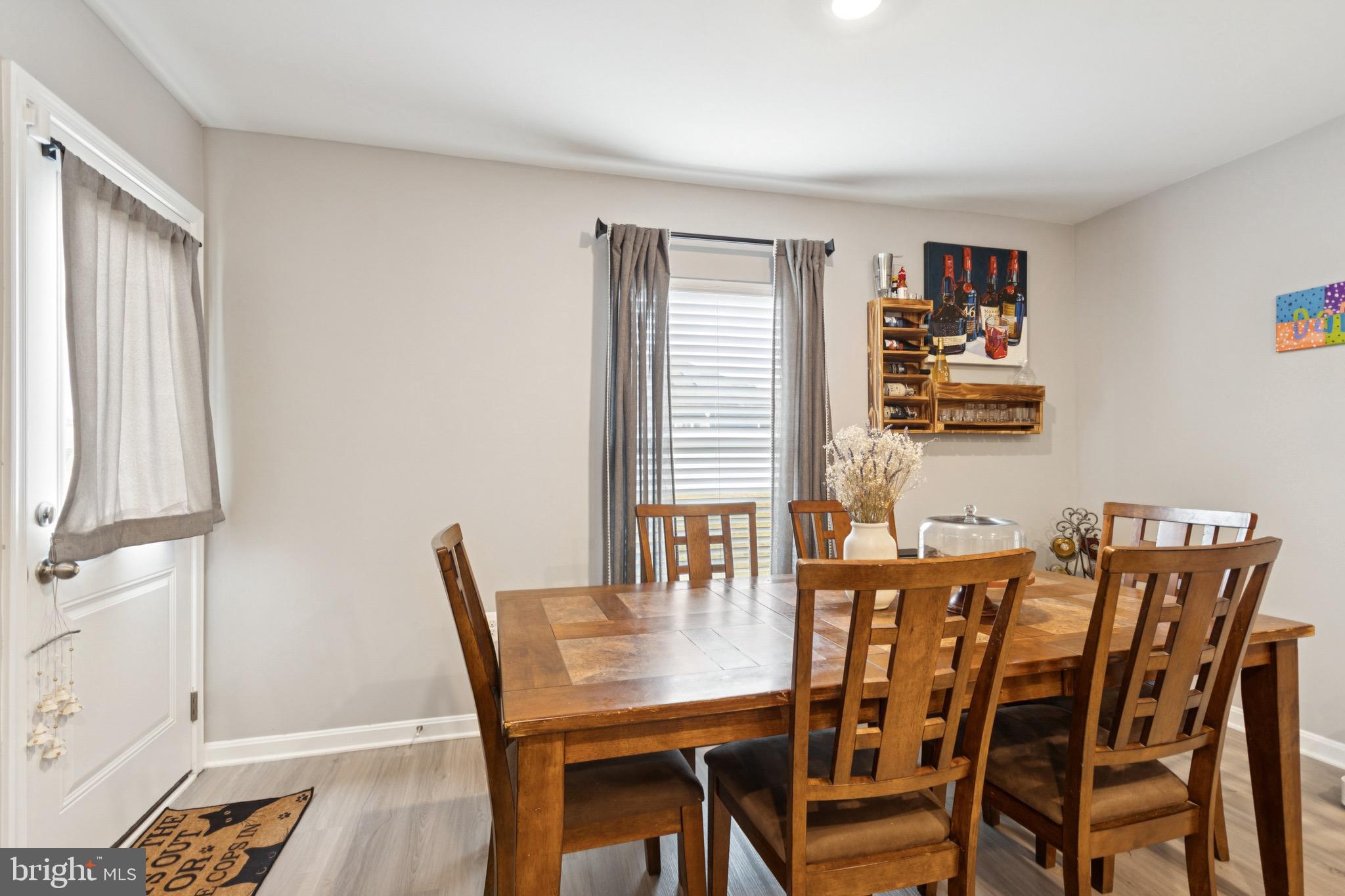 17063 Rollins Road Bowling Green, VA 22427 - Photo 15 of 40 a view of a dining room with furniture and wooden floor