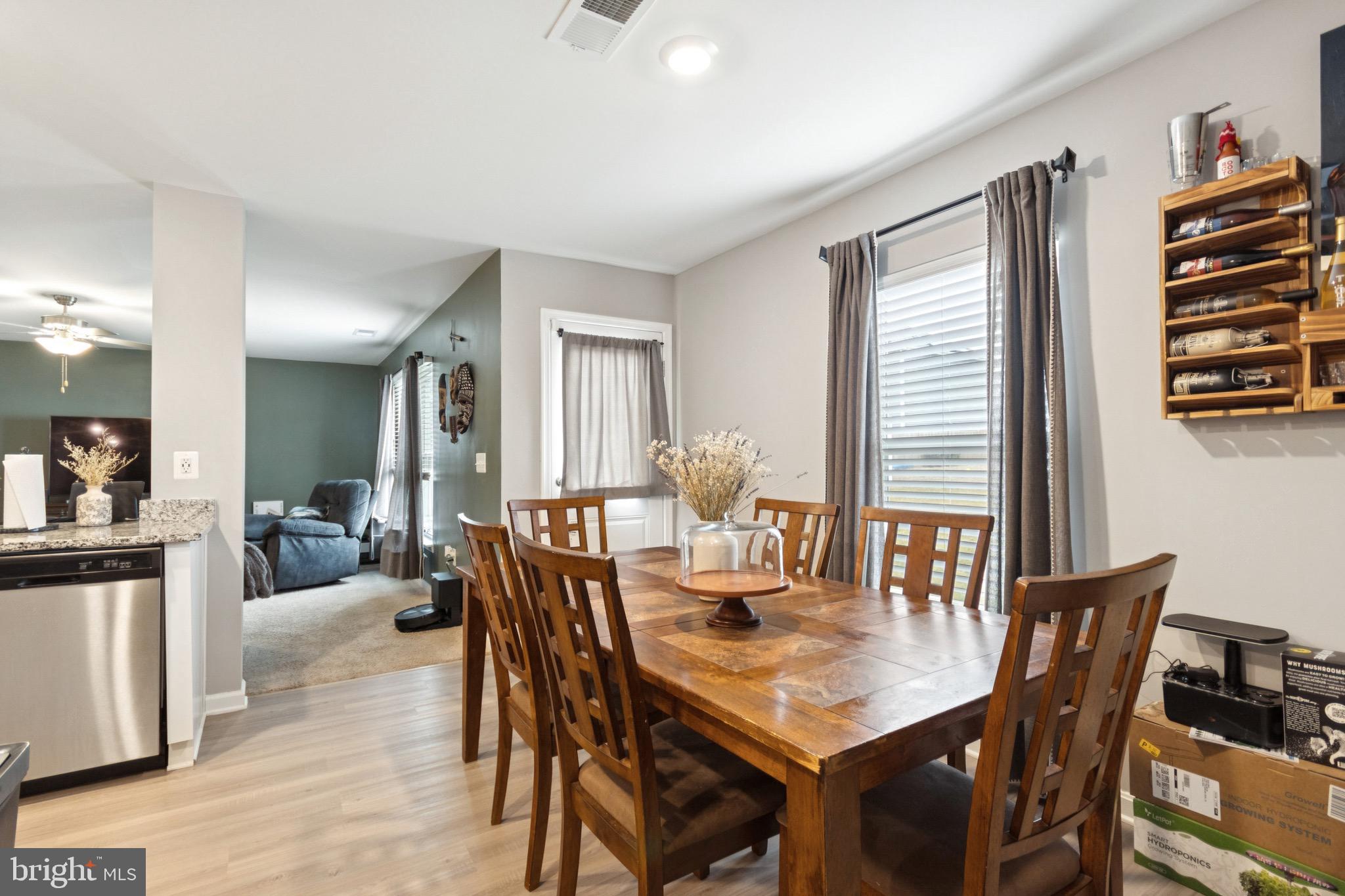 17063 Rollins Road Bowling Green, VA 22427 - Photo 16 of 40 a view of a dining room with furniture and wooden floor